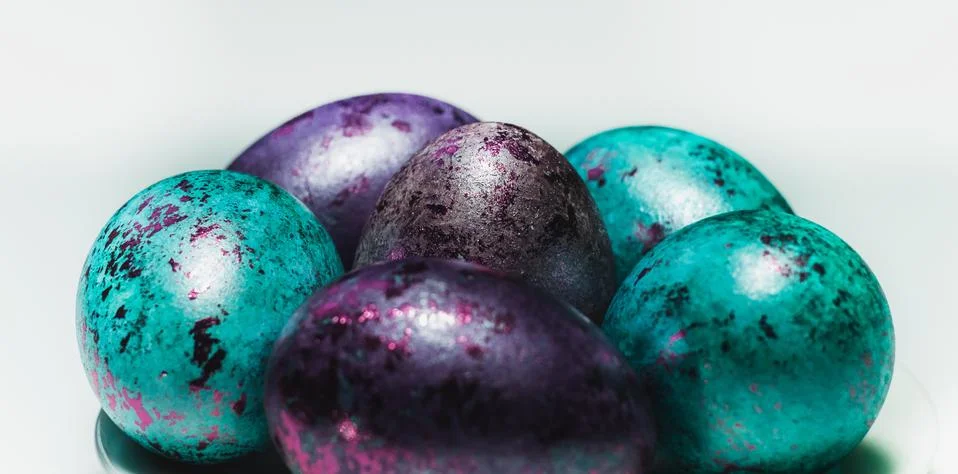 Close-up of colored Easter eggs. Screensaver for the bright holiday of Easter. Stock Photos