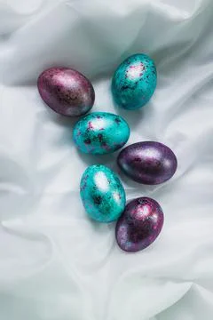 Close-up of colored Easter eggs. Screensaver for the bright holiday of Easter. Stock Photos