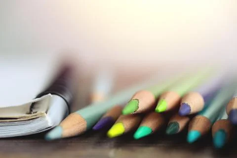 Close up of colored pencils and notebook, macro Stock Photos