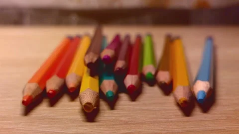 Close-up of colored pencils lying disorderly on the table Stock Footage 250398597