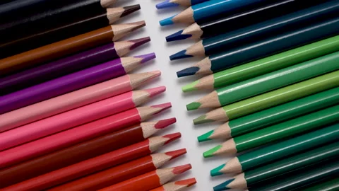 Close-up of colored pencils row on white background Stock Footage 130519357