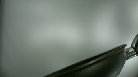 Close-up of colored pieces of vegetables is fried and tossed in a pan Stock Footage 113628112