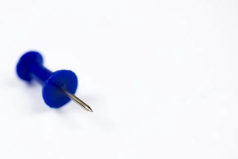 Close-up of a colored pin on a white background, isolate with space for text Stock Photos