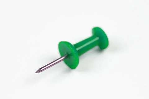 Close-up of a colored pin on a white background, isolate with space for text Stock Photos