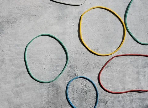 Close-up of colored rubber bands on a light background. Фото