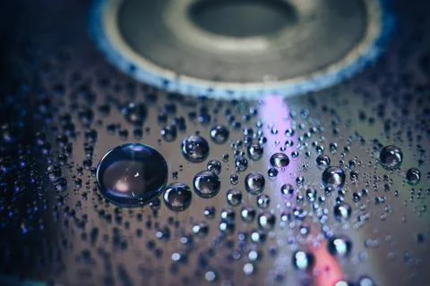 Close up colored water drops on a cd dvd disk background. Foto stock