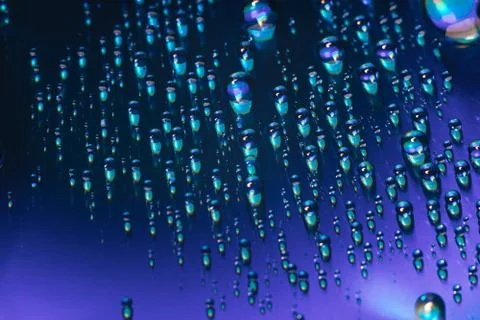 Close up colored water drops on a cd dvd disk background. Foto stock