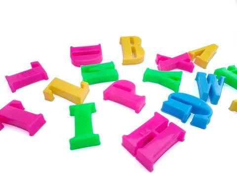 Close up of colorful alphabets on white background perfect for children's edu Stock Photos