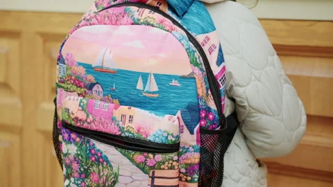 Close up of a colorful backpack with detailed patterns and zippers Stock Footage 336795301