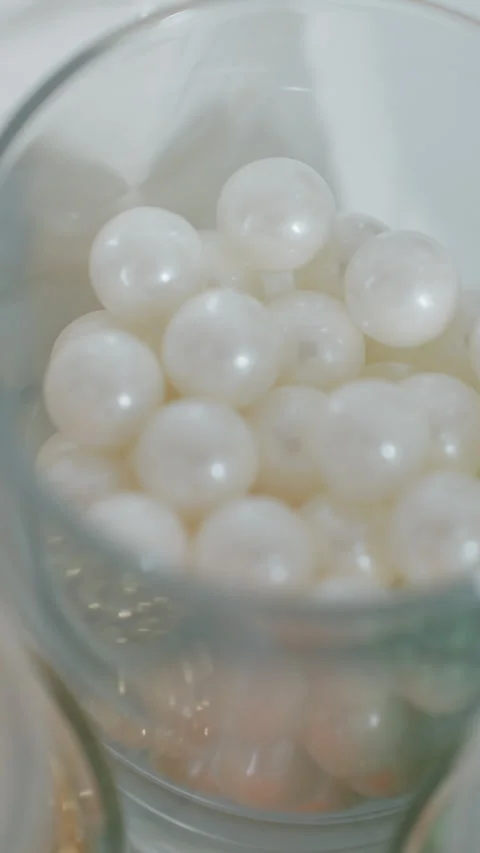 Close-Up of Colorful Beads and Sugar in Glass Cup for Baking and Decoration Stock Footage 320337029