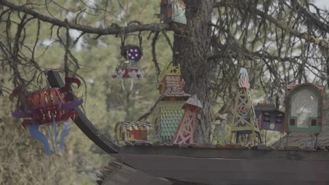 Close up of colorful cabin in forest with abstract formations at festival Stock Footage 122380048