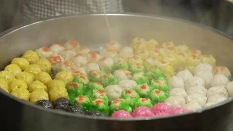 Close up of Colorful Dim Sum Siu Mai Steamed Dumplings in big Steaming pot at Stock Footage 341780216