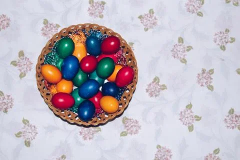 Close up of colorful Easter eggs in a basket. Happy Easter, Christian religio Stock Photos