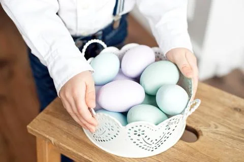 Close up of colorful Easter eggs in a basket. Stock Photos