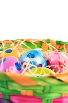 Close up of colorful Easter eggs in a basket Stock Photos
