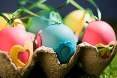 Close-up of colorful Easter eggs in crate Stock Photos