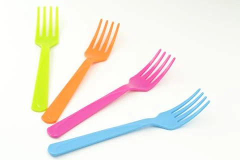 Close up colorful forks on white background Stock Photos
