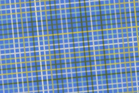Close-up of colorful grid pattern on fabric or paper Stock Photos