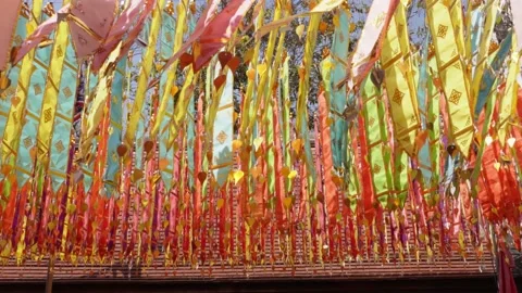 Close up of colorful hanging flags	 Stock Footage 232313199