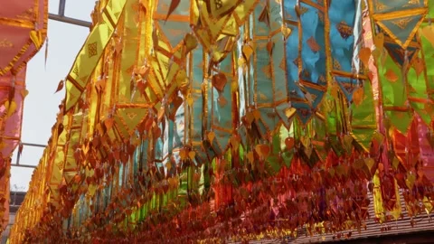 Close up of colorful hanging flags Video stock 232313578