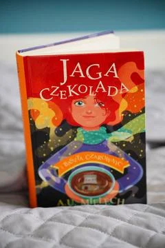 Close-up of a colorful hardcover Polish children's book. Jaga Czekolada i baszta Stock Photos