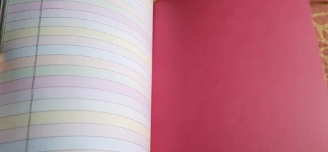 Close Up of Colorful Lined Project Book Pages Being Flipped Open 動画素材 330721106