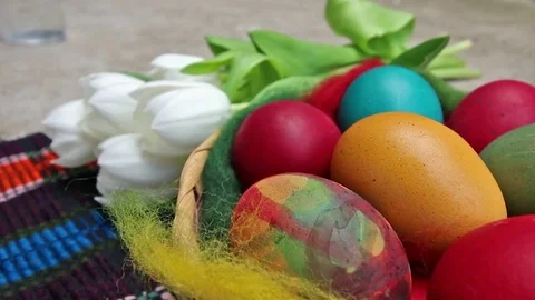Close up of colorful painted easter eggs in a basket - hd video Stock Footage 74494427