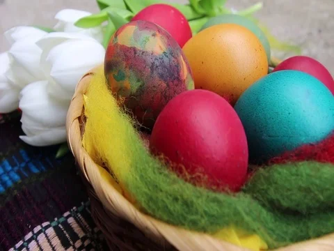 Close up of colorful painted easter eggs in a basket Stock Footage 84803356