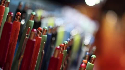 Close up of colorful pens displayed in rows with shallow depth of field highligh Stock Footage 317506498