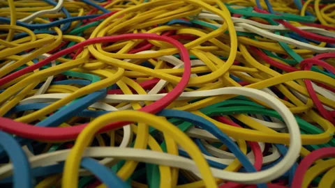 Close-up colorful ring shaped rubber bands background Stock Footage 147079102
