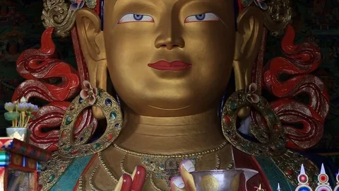 Close up colorful sculpture Maitreya buddha at Thiksey Monastery, Ladakh, India Stock Footage