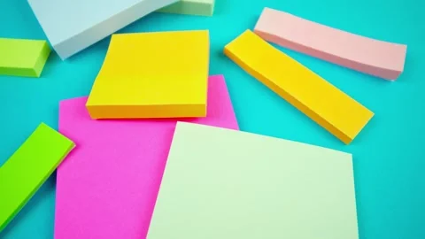 Close-Up of Colorful Sticky Notes Animation on Solid Background Stock Footage 339104636
