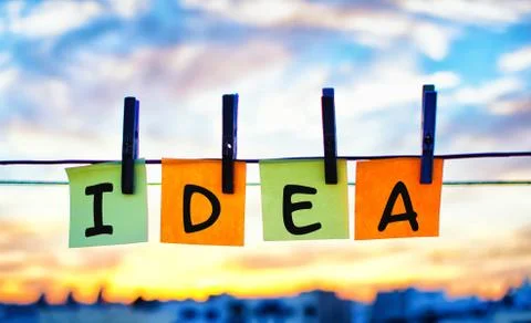 Close up of colorful sticky notes with a idea word text on them hanging outdoor Stock Photos