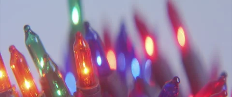 Close-up of colorful string lights bulb anamorphic 4K sliding video Stock Footage 320100059