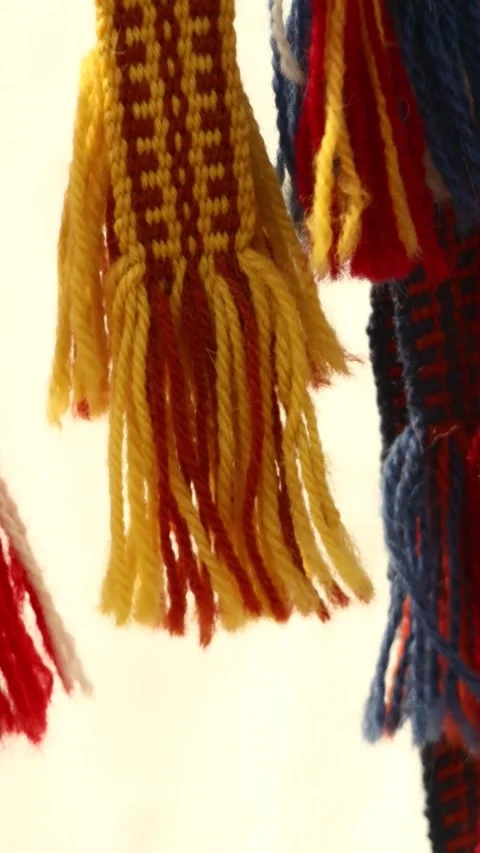 Close-up of colorful tassels on a string, suitable for decoration or craft .. Stock Footage 344158618