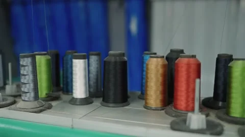 Close-up of Colorful Thread Spools on Industrial Sewing Machine Detail Stock Footage 321341481