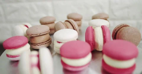 Close up of colorful white, red, and caramel chocolate macarons dessert, filling Stock Footage 150402964