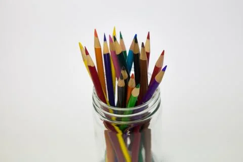 Close up of coloring pencils in a class mason jar Stock Photos