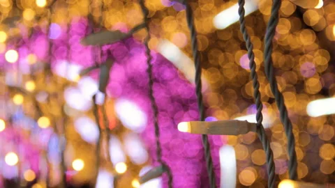 Close up of coloured light bulbs in light tunnel. Christmas street decorations, Video stock 120032400