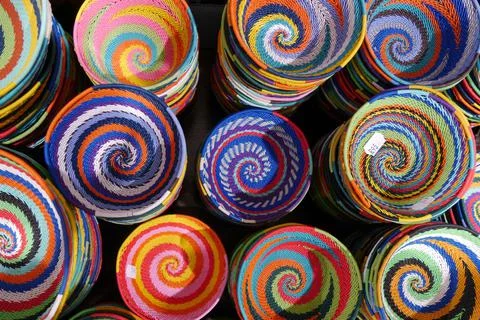 Close up of colourful, handmade brightly patterned souvenir baskets Stock Photos