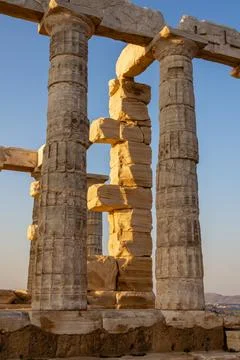 Close-up columns of the Temple of Poseidon in Cape Sounion, Greece. Stock Photos