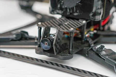 Close-up of combat quadcopter drone with exposed components, showcasing textu Stock Photos