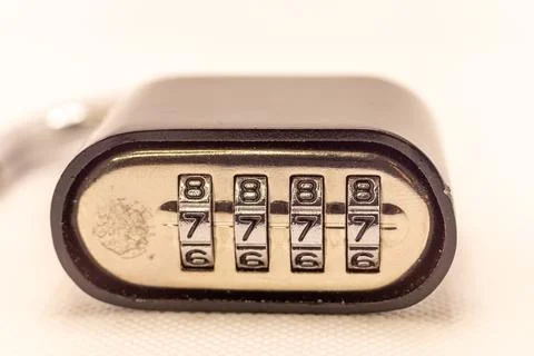 A close-up of a combination lock with the numbers 8766 visible on its dials,  Stock Photos