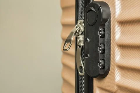 A close up of a combination lock on a suitcase Stock Photos