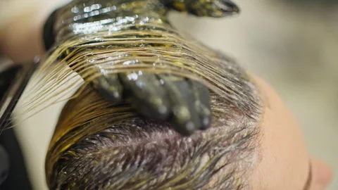 Close-up of combing hair that has been treated with a medicinal product Stock-Footage 336146372