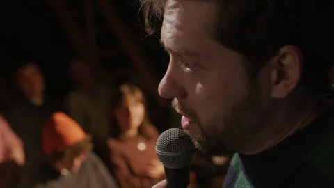 Close Up of Comedian Speaking into Microphone during Live Stand Up Show Stock Footage 333227676