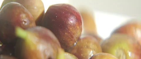 Close-up of common fig fruit pile sliding 5.7K anamorphic video Stock Footage 316113598