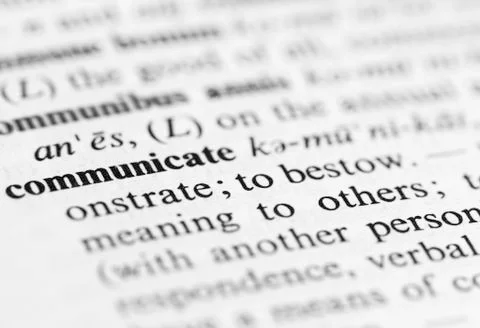 Close up of communicate definition Stock Photos