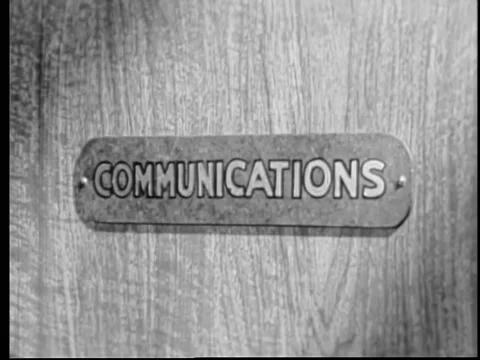 Close-up of communications sign on door Stock Footage 260240499