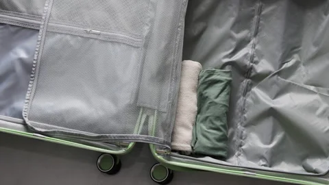 Close up of compact suitcase packing. Stock Footage 311903544